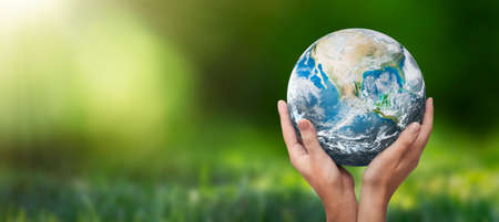 Hands raised to Earth globe. Environment protection. Global energy crisis, sustainability concept.の写真素材