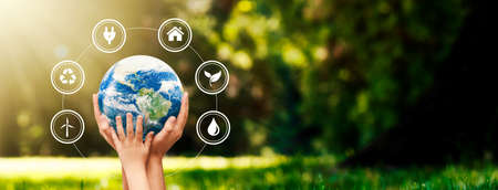Hands raised to Earth globe. Environment protection. Global energy crisis, sustainability concept.の写真素材