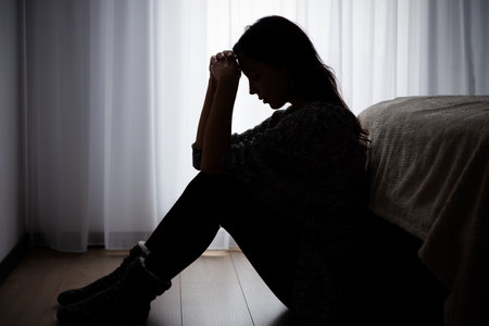Woman suffering from depression. Sadness and headache conceptの写真素材