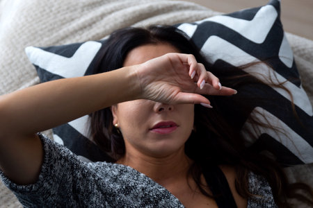 Woman suffering from depression. Sadness and headache conceptの写真素材