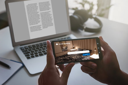 Man makes hotel reservations via the internet. Tourism, vacation conceptの写真素材
