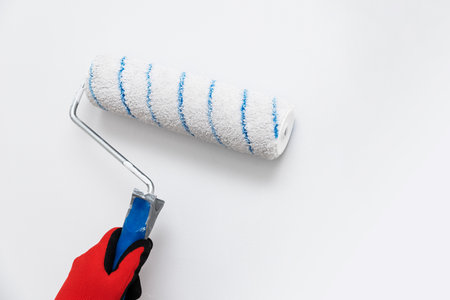 Close up of painter, roller painting. Painting, renovation wallsの写真素材