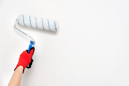 Close up of painter, roller painting. Painting, renovation wallsの写真素材