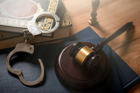 Handcuffs and wooden gavel. Crime, legal and violence concept.の写真素材