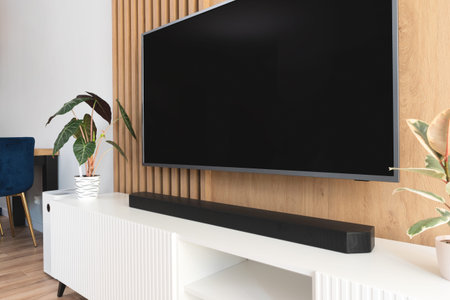 Soundbar in a modern home. Listening to music in the living room