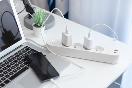 Electrical plug in outlet socket at home. Electrical equipment, electrical wires and power strips in the houseの写真素材