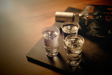 Glasses with vodka on the table. Alcohol closeupの写真素材