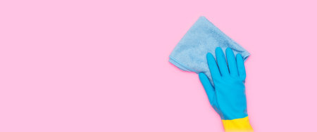 Cleaning services, hand with a yellow sponge in blue glove