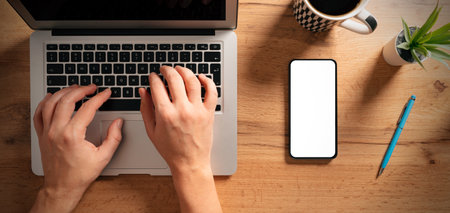 Smartphone mockup, empty, white screen on desk, top viewの写真素材