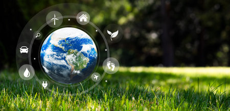 Earth globe on grass, climate change and ecology conceptの写真素材