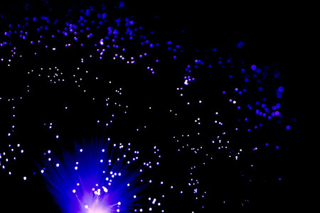 Abstract fiber optic light background in the dark. Fast internet background concept