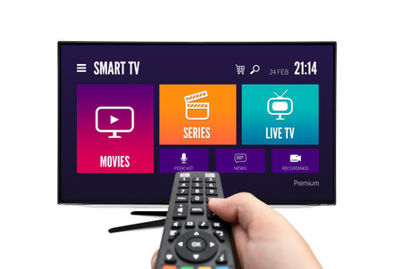 VOD multimedia TV streaming concept with hand holding remote controlの写真素材