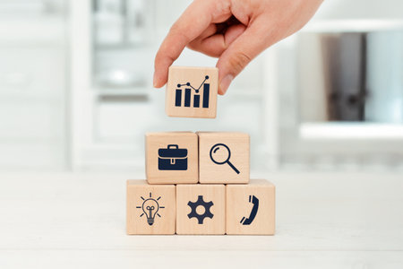 Business concept with wooden blocks with icons. Building business strategy conceptの写真素材
