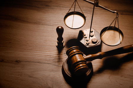 Judge gavel and legal book on wooden table, justice and law conceptの写真素材