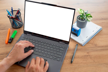 Man using laptop with blank screen, copy space