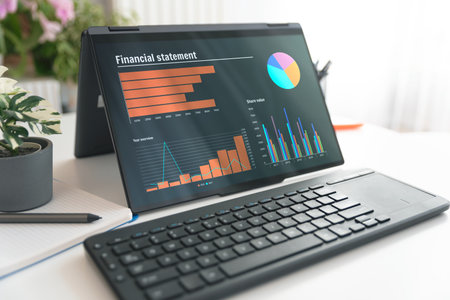 Laptop 2 in 1 with financial data analysis on screen. Analyst's office.の写真素材