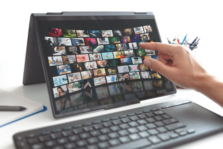 VOD streaming service on screen. Video on demand app. Man pointing screen