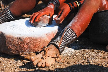 Himba girl at the workの写真素材