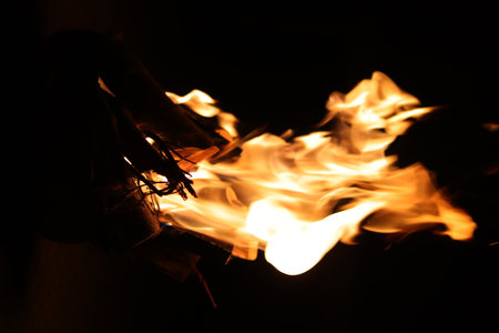 Fire flames on a black background, closeup of fire flames.の写真素材