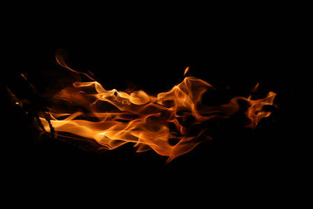 Fire flames on black background, abstract blaze fire flame texture background.