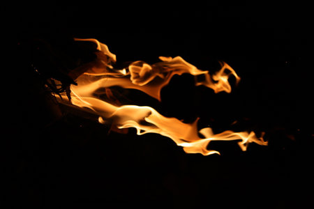 Fire flames on a black background, fire patterns on a black backgroundの写真素材