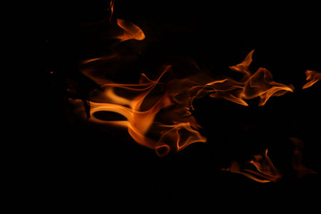 Fire flames on black background, abstract blaze fire flames isolated on black background