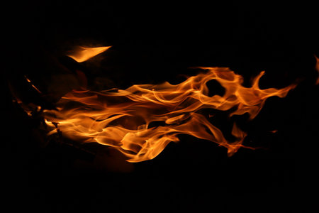 Fire flames on a black background as an abstract background. textureの写真素材