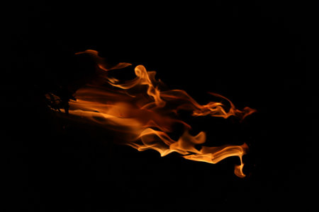 Fire flames on a black background. Fire flames isolated on black backgroundの写真素材