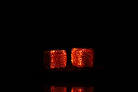 Glowing coals with glitch style lighting, enriched by noise, effect and grain details, create a...