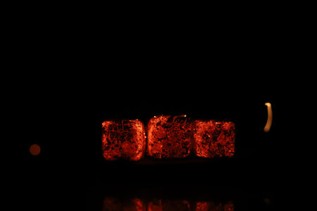Glowing coals with glitch style lighting, enriched by noise, effect and grain details, create a...