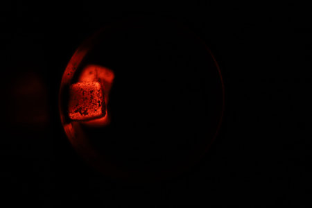 Glowing coals with glitch style lighting, enriched by noise, effect and grain details, create a...