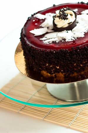Black forest chocolate cake on isolated background on glass plateの写真素材