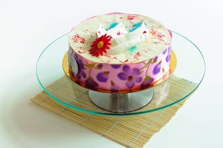 Cream cake on isolated background on glass plateの写真素材