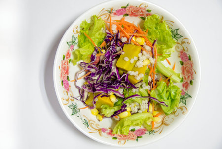 Delicious salad on a bowl isolated over whiteの写真素材