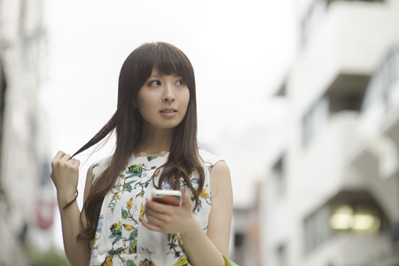 Asian woman shopping, closeup portrait in the mallの写真素材