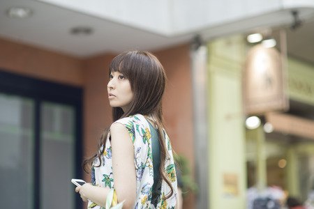 Asian woman shopping, closeup portrait in the mallの写真素材