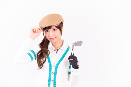 Young woman golf player smiling isolated on white background.の写真素材