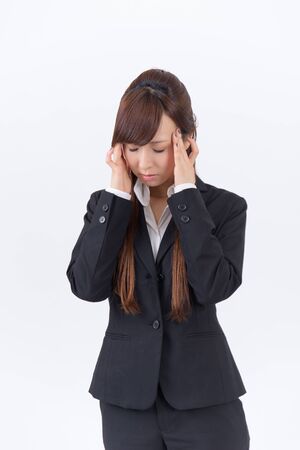 Japanese young woman with a headache holding head, isolated on white backgroundの写真素材