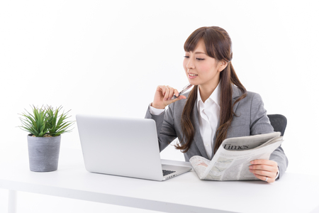Young Japanese businesswoman to the stock tradingの写真素材