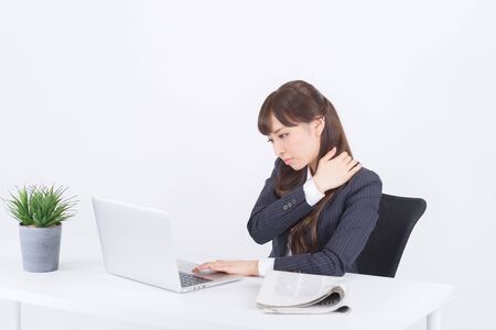 Young Japanese businesswoman is fatigueの写真素材