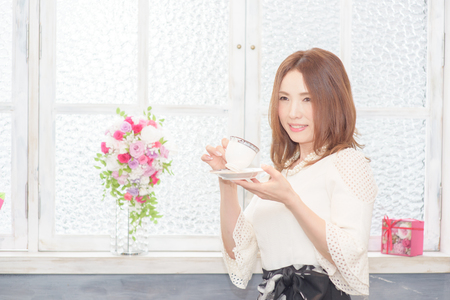 One beautiful Japanese woman  to enjoy coffeeの写真素材