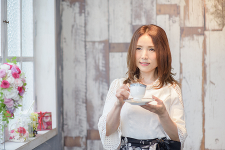 One beautiful Japanese woman  to enjoy coffeeの写真素材