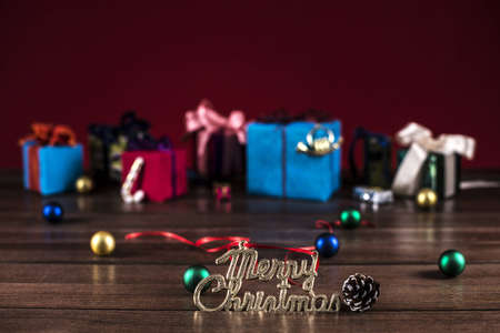 the gold words mary christmas and multi-colored gift boxesの写真素材