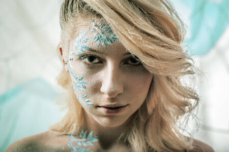 portrait of beautiful fashion girl winter snowの写真素材