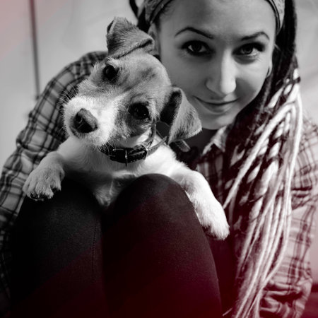 beautiful girl with dreadlocks and dog Jack Russell terrierの写真素材