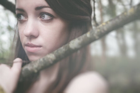 beautiful sensual woman in wood harmony with natureの写真素材