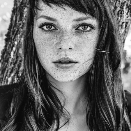 beautiful woman with in autumn park black and white