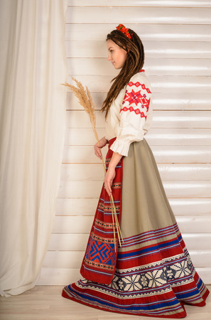 young woman in a Slavic Belarusian national original suit studioの写真素材