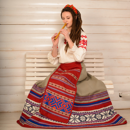 young woman in a Slavic Belarusian national original suit studioの写真素材