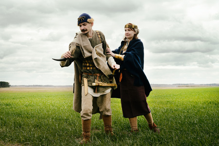 woman and man in ethnic suit context of historical reconstruction